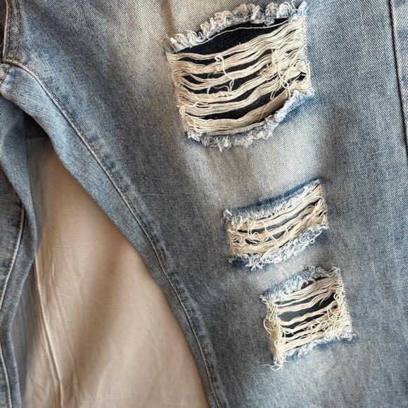 Ripped Jeans with Star Accents - Picture 5 of 16